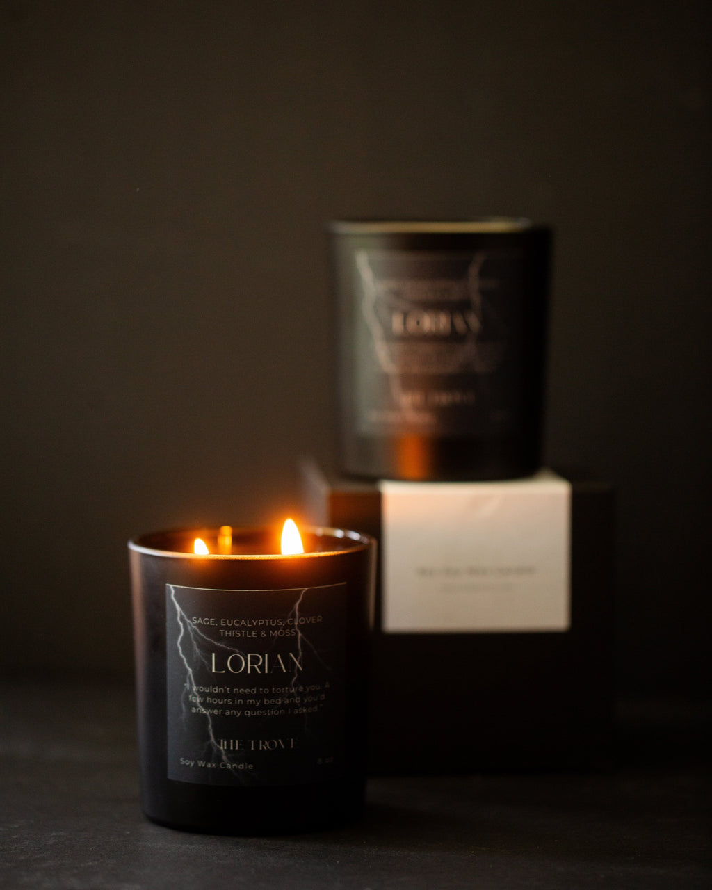 Candle with a visible label in a dark setting