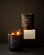 Candle with a visible label in a dark setting