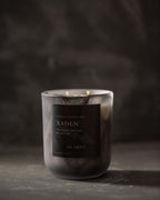 Candle with a dark label on a dark background