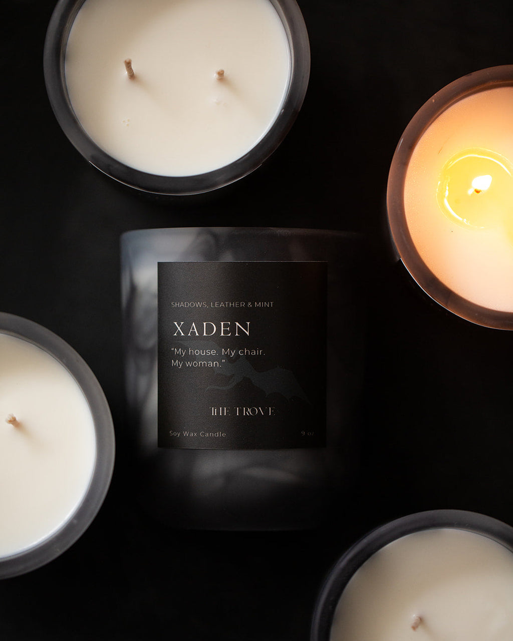 Xaden candles with a dark background