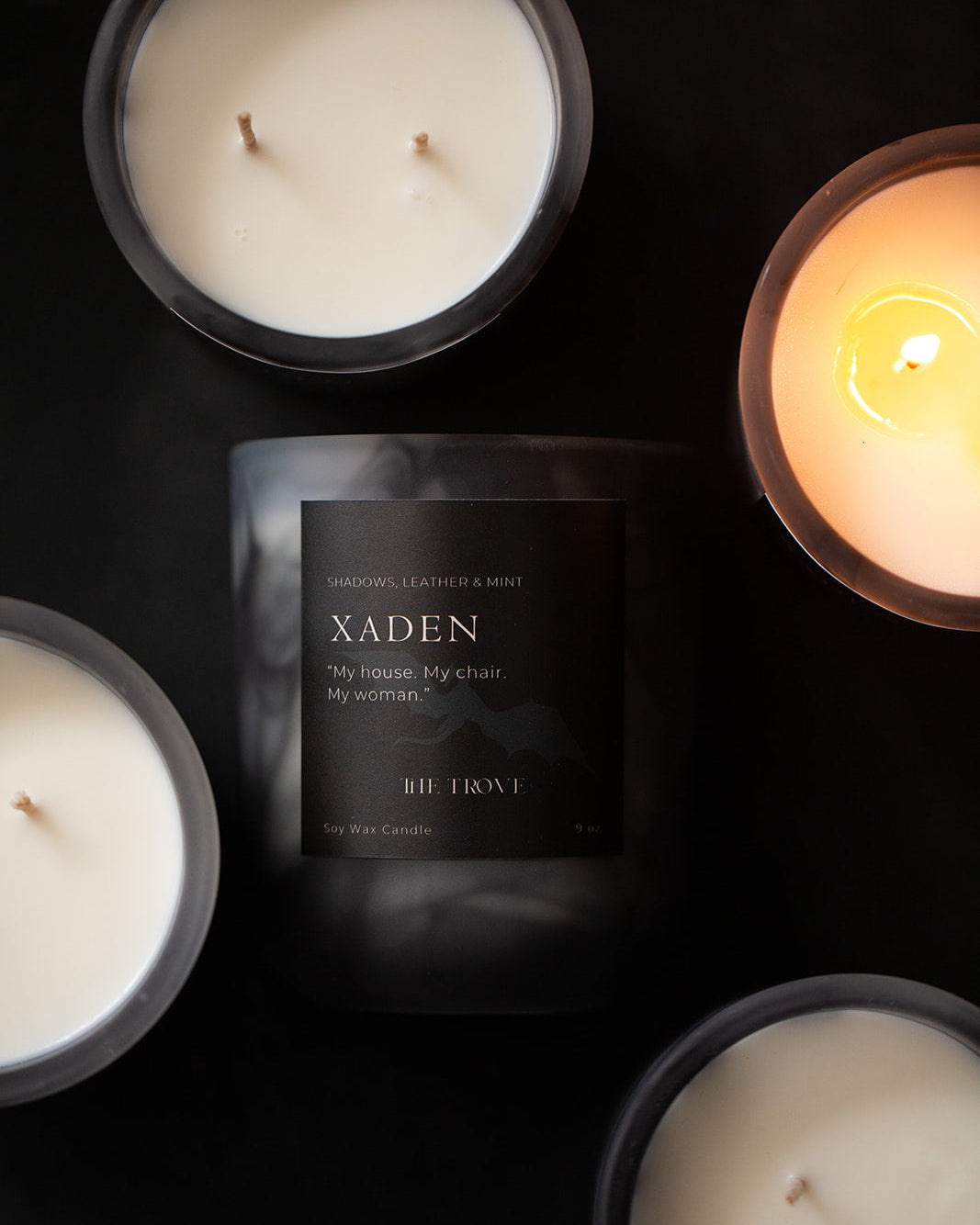 Xaden candles with a dark background