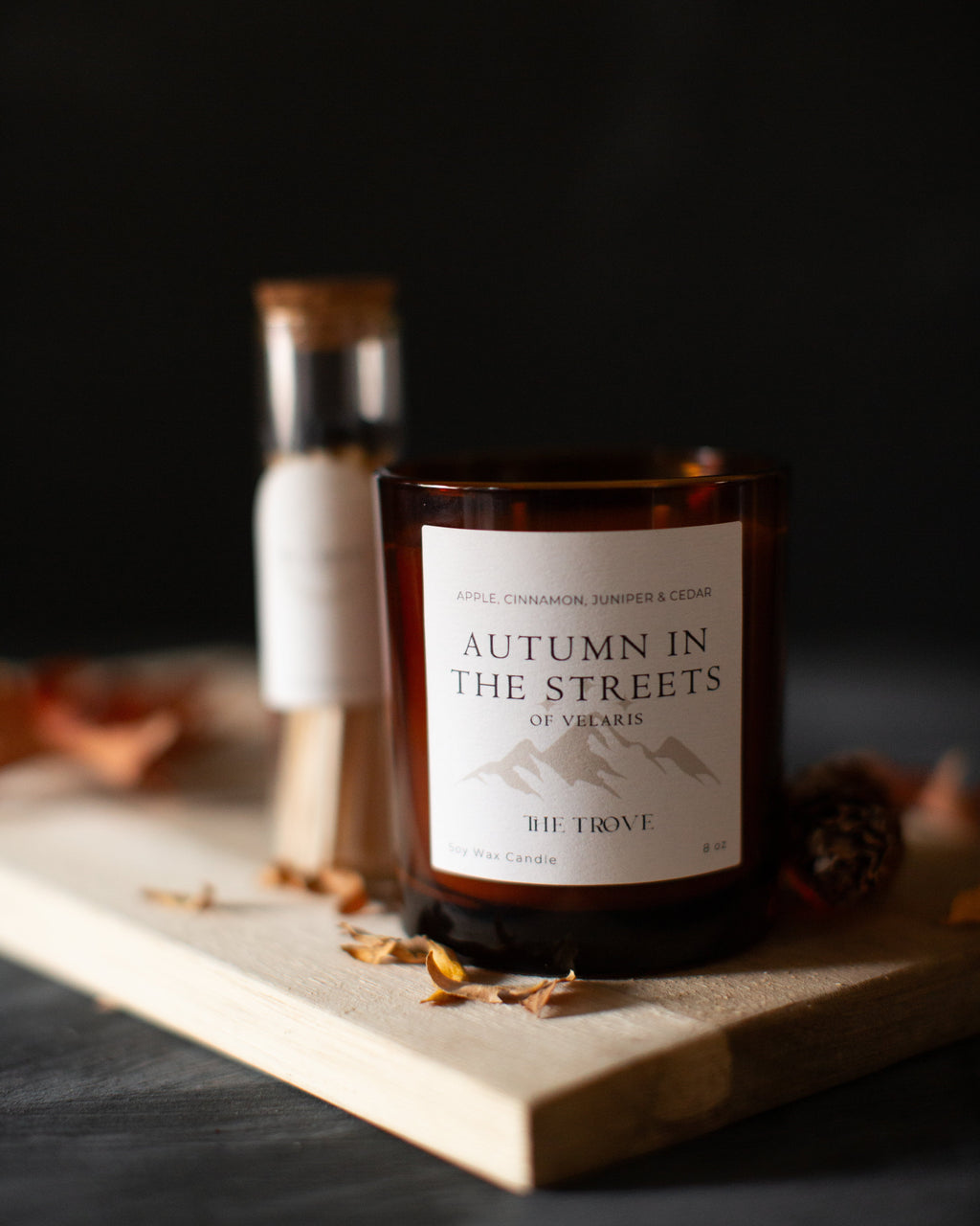 Candle labeled 'Autumn in the Streets of Vienna' on a dark background